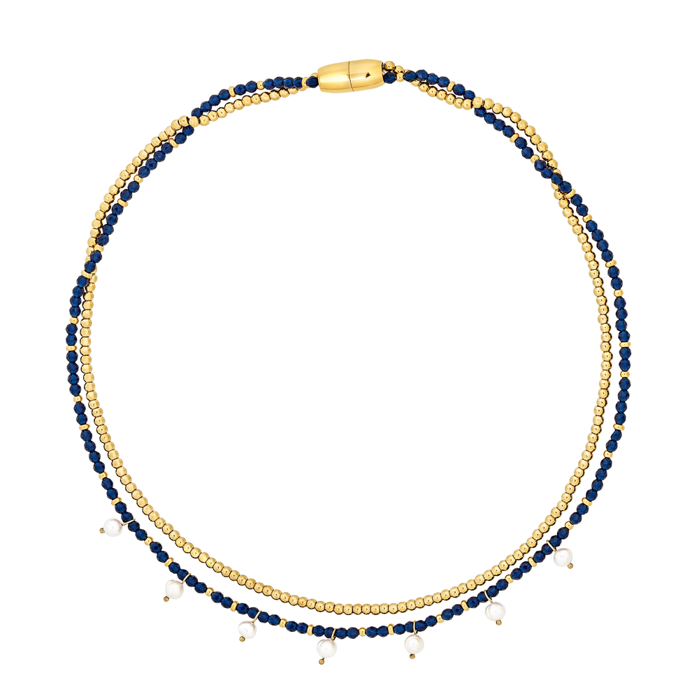 Collana Dunes and Stars da donna della collezione Magnetica System in acciaio Breil inossidabile con finitura PVD oro 14K, composta da una catena a microsfere e da un filo di cristalli blu impreziosito da 7 perle coltivate d'acqua dolce.